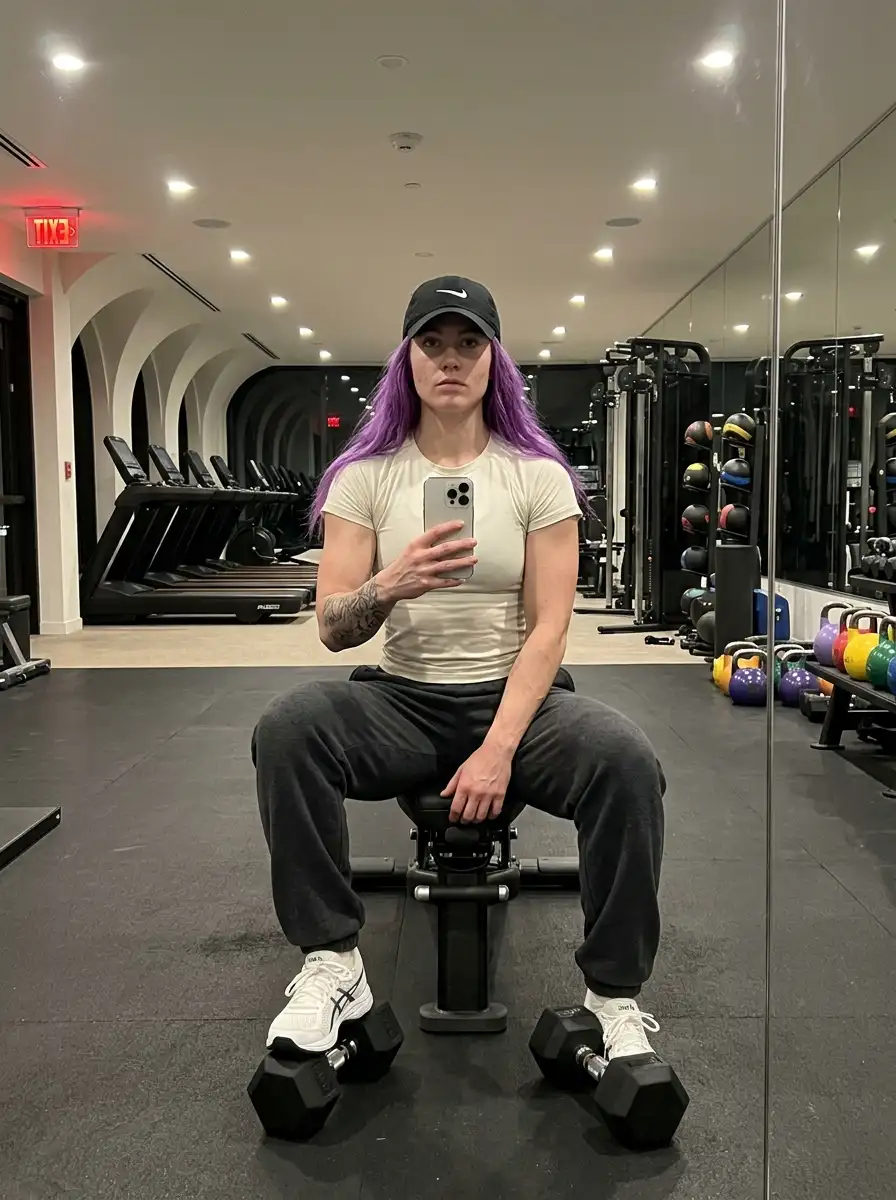 Woman_taking_mirror_selfie_gym_202607121933