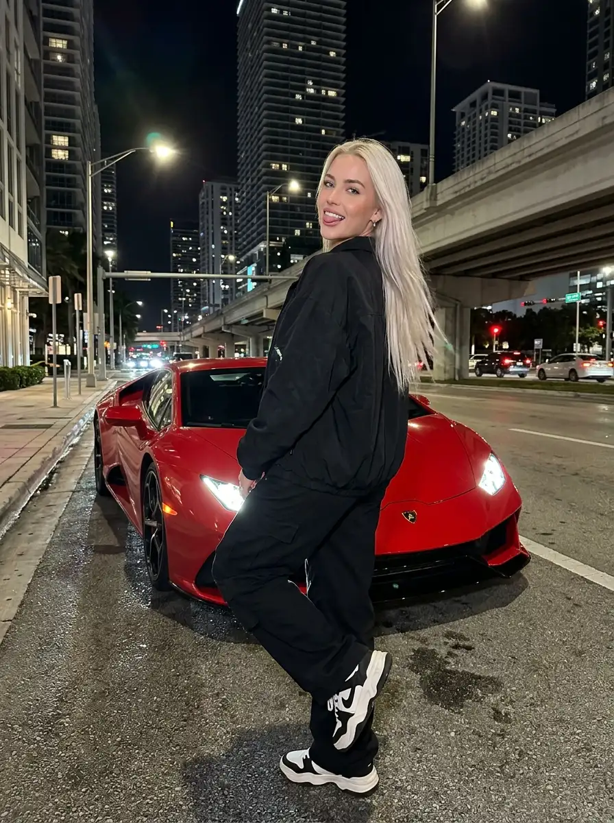 Woman_with_Lamborghini_on_street_202607141635